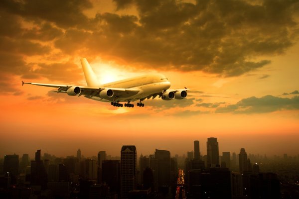 depositphotos_91350428-stock-photo-passenger-jet-plane-flying-over.jpg